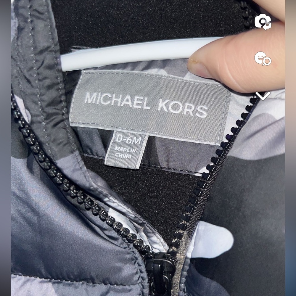 Never worn MK snow suit. Size: 0-6 months color: (black and grey camo.)